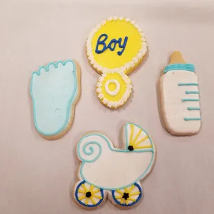 a baby shower, a stroller, and a bottle of milk