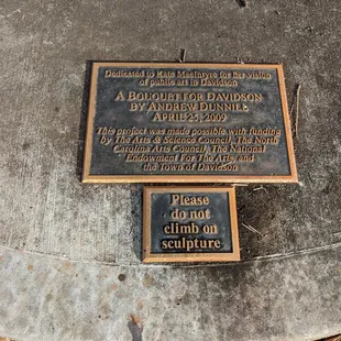 Plaque at the base of A Bouquet for Davidson Sculpture