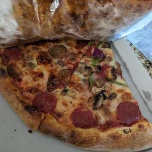 Supreme pizza, sausage and pepperoni