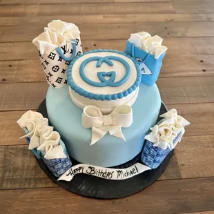 a blue and white birthday cake