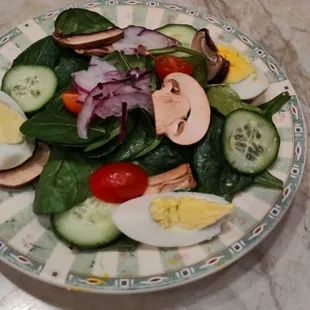 Warm spinach salad with bacon dressing