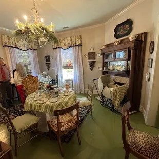 a dining room with a table and chairs