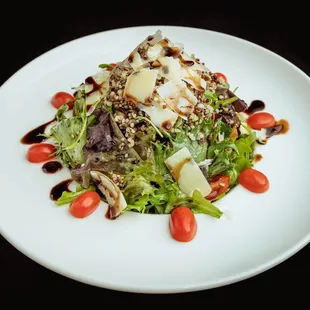 a white plate with a salad on it