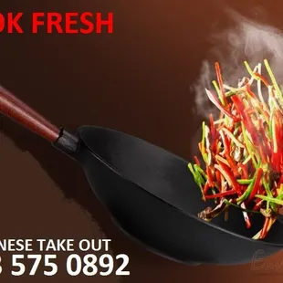 a wok filled with vegetables