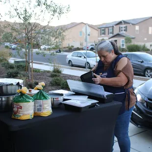 Mother ( Cuquita) and  daughter, prepping to give some tacos for Halloween