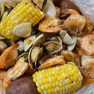 Shrimp(minus head), white clams, potatoes and corn in garlic butter.