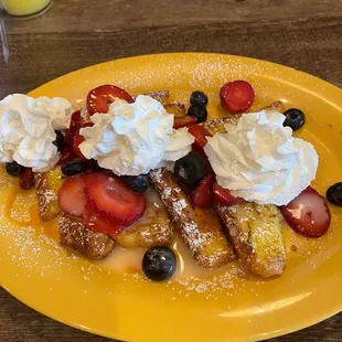 strawberries, blueberries, and powdered sugar