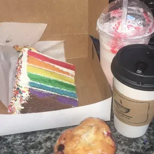 Pride cake, muffin, pina colada, and a red velvet cappuccino.