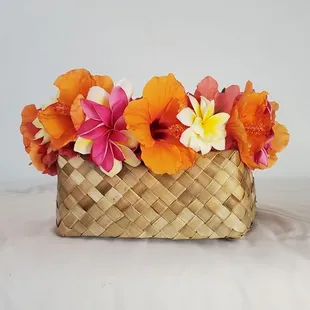 A Tropical lei po'o made from fresh plumeria and Hibiscus. Visit www.adaywithakalei.com to learn how to create this masterpiece or to order.