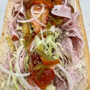 Top view : ham&amp;cheese w mustard light lettuce, tomatoes, sweet peppers, onions &amp; oregano