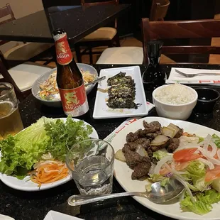 Saigon beer, tofu salad, beef wrapped in grape leaves, and cubed filet mignon. All were delicious!