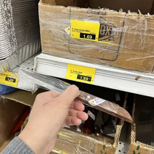 a person holding a pair of scissors