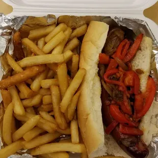 Sausage dog with peppers and onion. De. Lish!