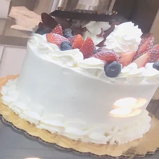  cake with berries and whipped cream
