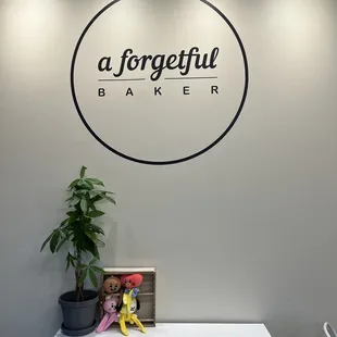 a white table with a plant on it