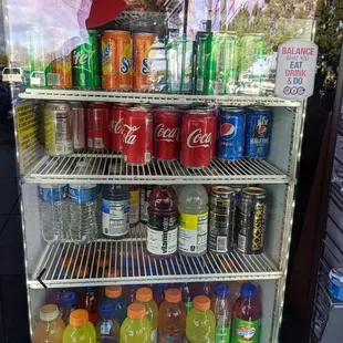 a refrigerator full of sodas