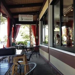Outdoor eating area with a stunning view of a parking lot and the El Camino