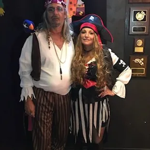 a man and a woman dressed in pirate costumes