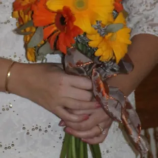 orange and yellow gerbera daisy wedding bouquet with eucalyptus accents
