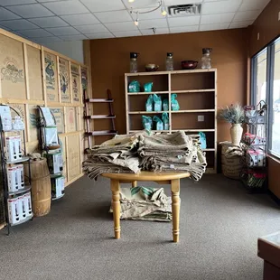 a room with a table and shelves