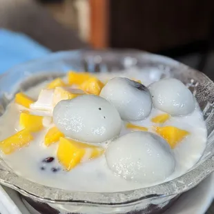 Sesame ball and mango over purple rice