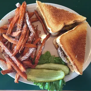 Sweet potato fries with powdered sugar and bacon n cheese on French toast bread. Yum!
