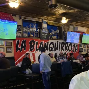  a man sitting at a bar