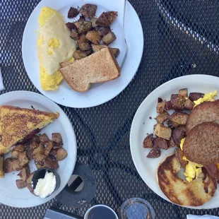 two plates of breakfast food