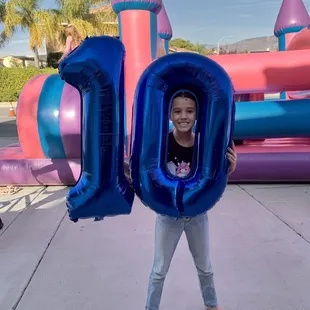 My daughter in front of the obstacle course jumper