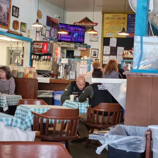 The hubbub around the cashier and bar, on a not-busy Friday at the lunch hour.