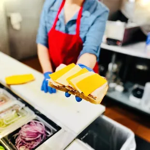 a woman holding a sandwich