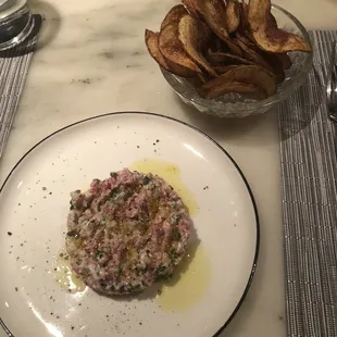 Beef tartare with cauliflower, yogurt, and house-made dill chips