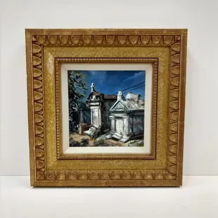 A miniature mausoleum painting by New Orleans artist, Ashly Griffith framed in a buff linen liner and an ornate 22kt gold frame.