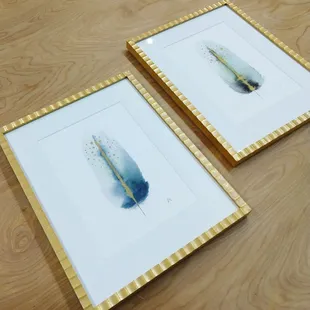 Watercolor paintings by New Orleans artist, JK framed in soft white mats and fun scalloped gold frames.