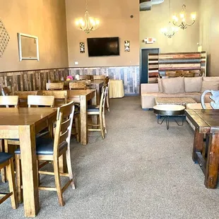 a dining area with tables and chairs