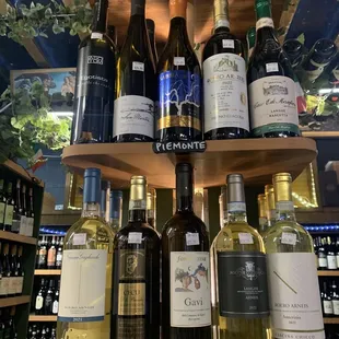 a variety of wine bottles on a shelf