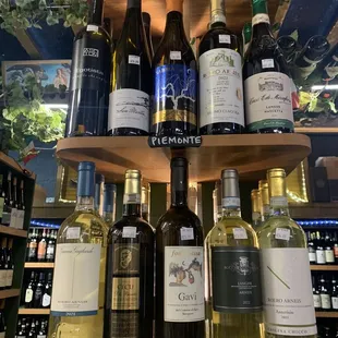 a variety of wine bottles on a shelf