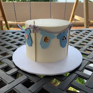 Sporty onesie clothesline cake