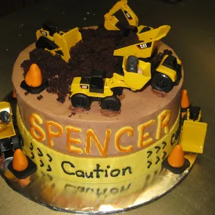 a cake with construction vehicles on it