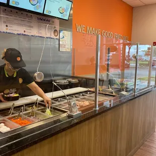 Food is enclosed in plexiglass and an amplifier speaker allows e Food selections protected by plexiglass with a speaker for ordering