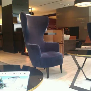 Comfy chairs by the window for optimal people watching.