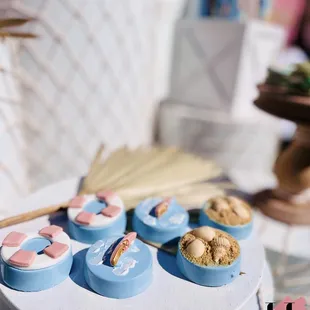 surfboard beach dessert buffet bar surf theme surfin birthday party Oreos shark bite seashell treat table fish netting plinths girl pastel