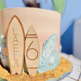 surfboard beach dessert buffet bar surf theme surfin birthday party sand treat table fish netting girl cake topper sunset cake ocean palm