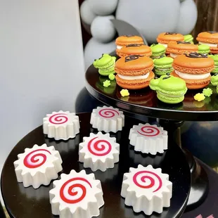Naruto 10th birthday party Shippuden Sasuke dessert bar buffet plinths Uzumaki narutomaki Oreos hidden leaf macarons organic balloon garland