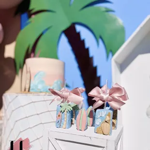 surfboard beach dessert buffet bar surf theme surfin birthday party seashell treat table marquee number Rice Krispies palm tree pastel girl