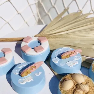 surfboard beach dessert buffet bar surf theme surfin birthday party Oreos shark bite seashell treat table fish netting plinths girl pastel
