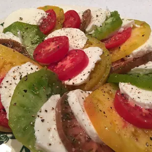 Caprese salad - heirloom tomatoes with fresh mozzarella cheese.