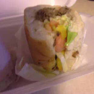 a sandwich in a styrofoam container