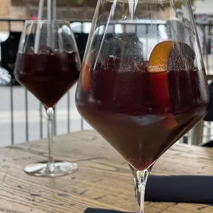 two glasses of wine on a table