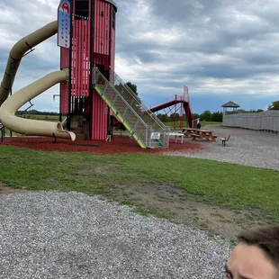 Giant silo playground and giant slide in background.